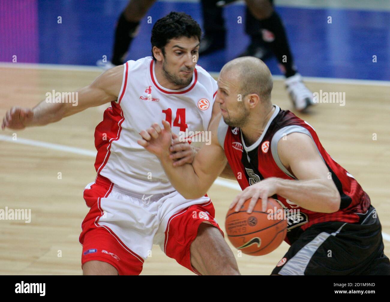 Dusan Vukcevic (L) of Armani Jeans Milano tries to stop Kenan Bajramovic of  Lietuvos Rytas during their Euroleague Group B men's basketball game in  Vilnius December 12, 2007. REUTERS/Ints Kalnins(LITHUANIA Stock Photo -