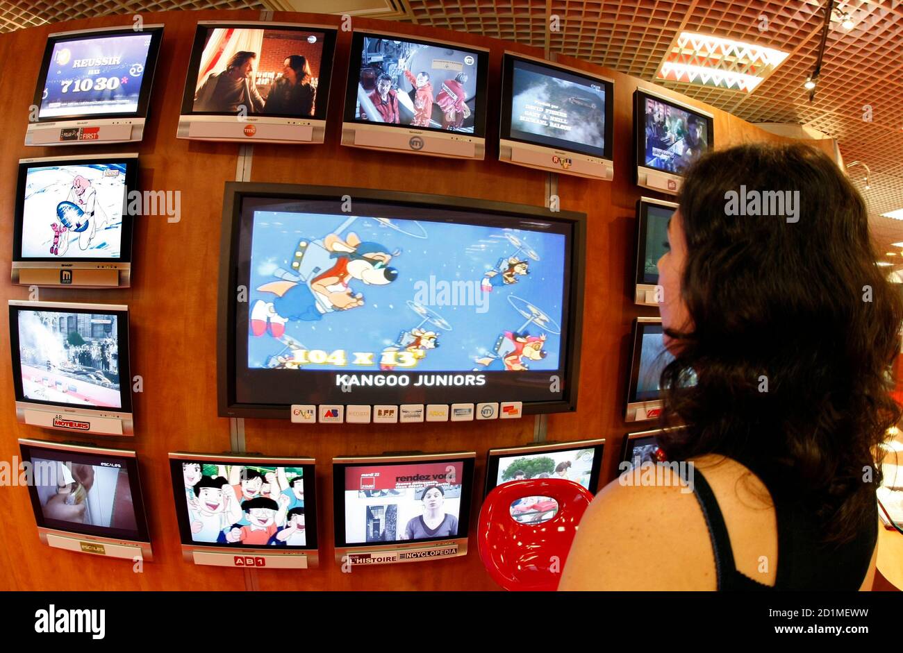 A visitor looks at television programmes during the annual MIPCOM television  programme market in Cannes, southeastern France, October 5, 2009. The  international film and programme market for TV, video, cable and satellite (