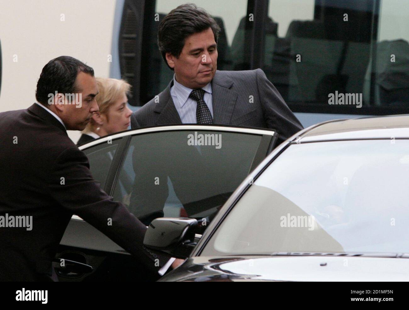 Chile's adviser to his embassy in Peru, Andres Barbe (R), leaves the Peruvian Foreign Ministry after receiving documents in Lima, November 18, 2009. Barbe received document related to a Peruvian military officer that has spied for Chile.  REUTERS/Mariana Bazo (PERU POLITICS) Stock Photo