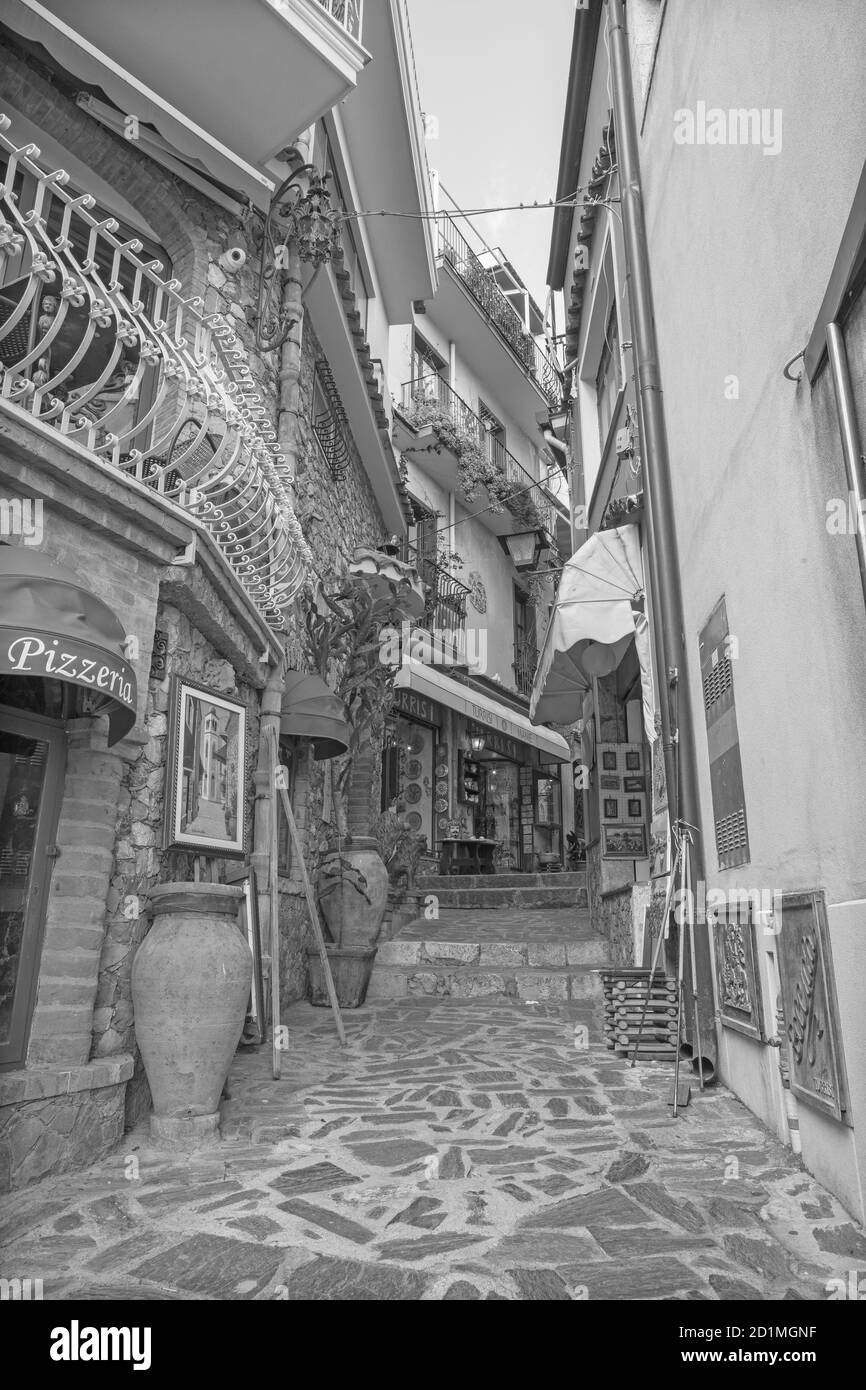 CASTELMOLA, ITALY - APRIL 9, 2018: The little main squere of the town with the shops. Stock Photo