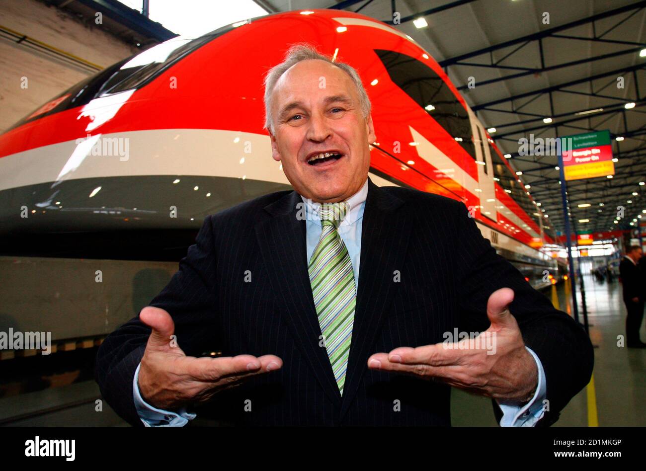 Bavarian Economy Minister Erwin Huber poses in front of a prototype of ...