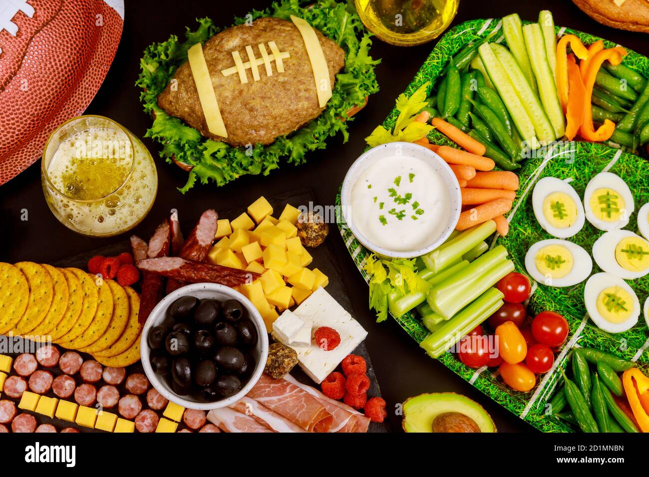 Healthy vegetable platter with meatloaf like a football for american football ball gamel fan party. Close up. Stock Photo