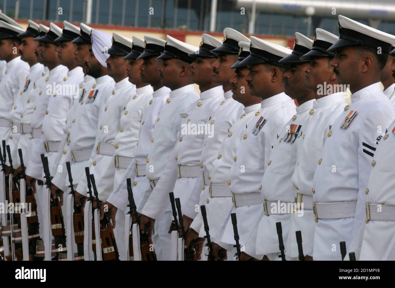 Sailors of Indian Coast Guard take part in a march during the commissioning ceremony of Air enclave at Porbandar, 415 km (258 miles) west of the western Indian city of Ahmedabad, June 12, 2008. Indian Coast Guard Air enclave at Porbandar is the first air base of the service in Gujarat. The unit is safeguarding vast 1600 km (994 miles) coastline which includes sensitive international Maritime border with Pakistan, monitoring dense merchant ships traffic in gulf areas and surveillance in adjoining Exclusive Economic Zone (EEZ), a press release of Indian Coast Guard said.  REUTERS/Amit Dave  (IND Stock Photo