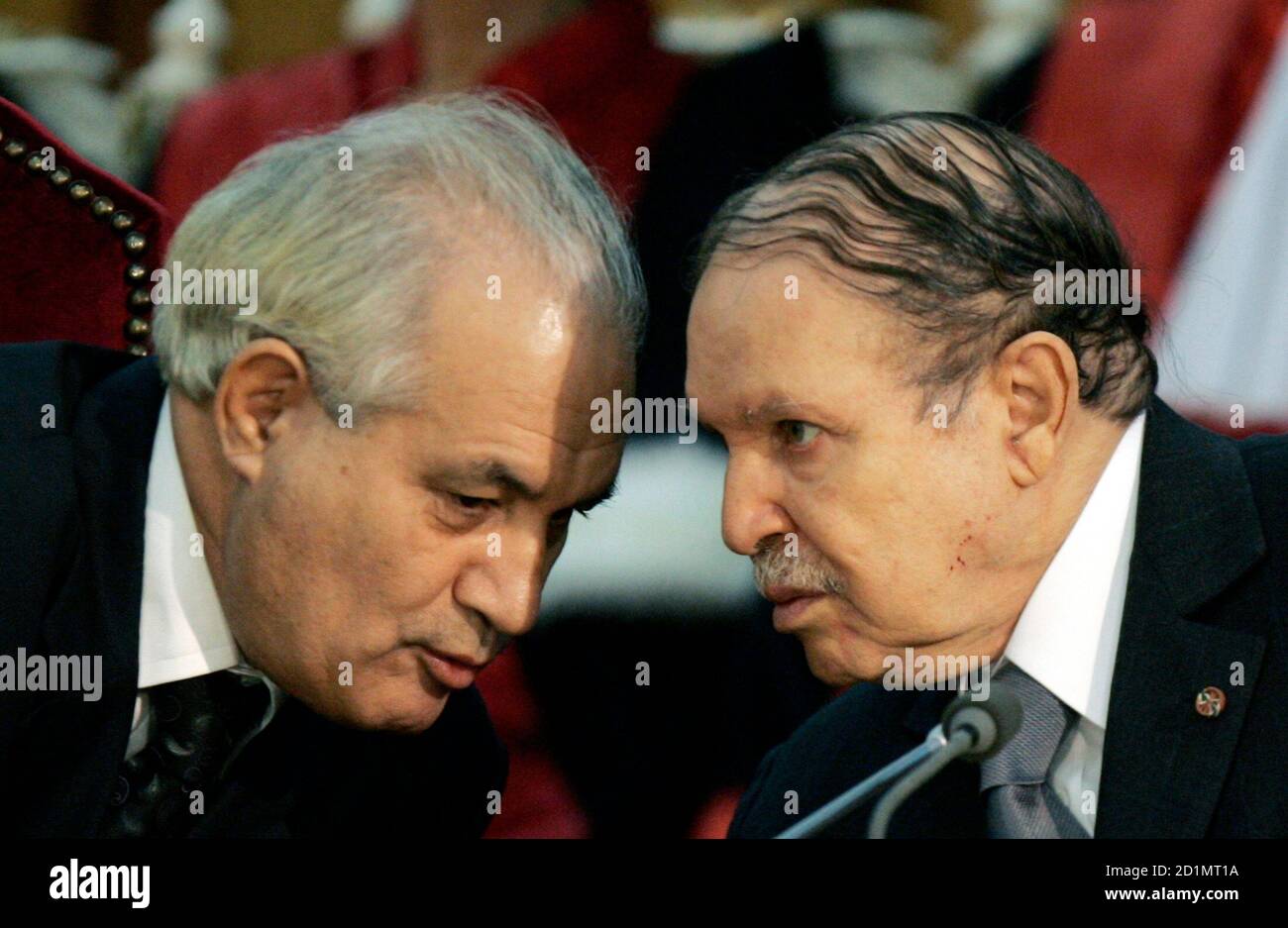 Algeria's President Abdelaziz Bouteflika (R) talks to Justice Minister Taidb Belaiz as they attend the opening ceremony of the judiciary year at the supreme court in Algiers October 29, 2008. Bouteflika, reaching the end of his second and final term, said on Wednesday he wanted to alter Algeria's constitution in a manner several analysts interpreted as meaning he intends to stay on. REUTERS/Louafi Larbi (ALGERIA) Stock Photo