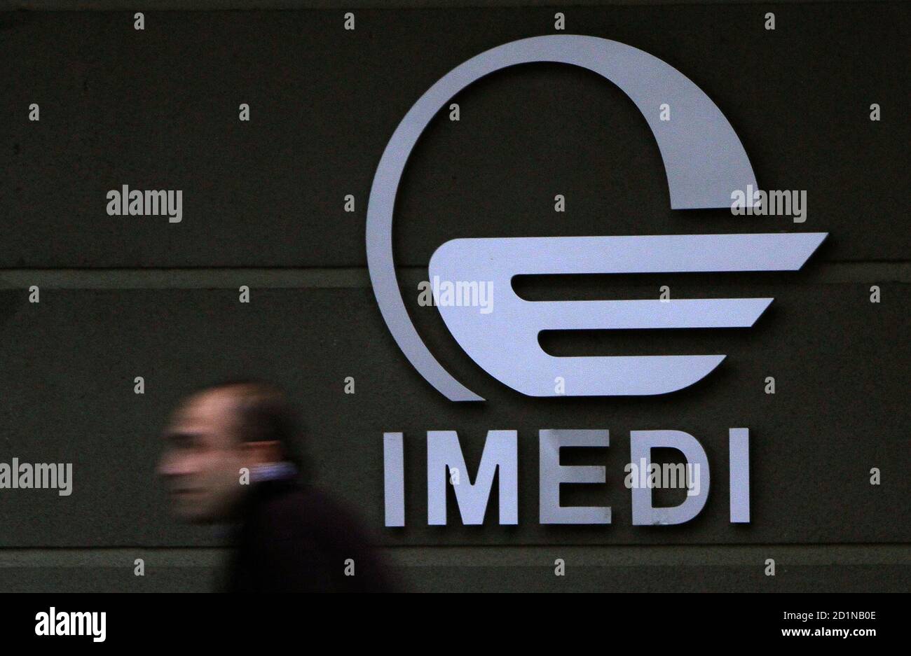 A man passes by a logo of Imedi TV station in Tbilisi March 15, 2010.  Western envoys on Monday condemned a fake news report in Georgia that  Russian tanks had entered the