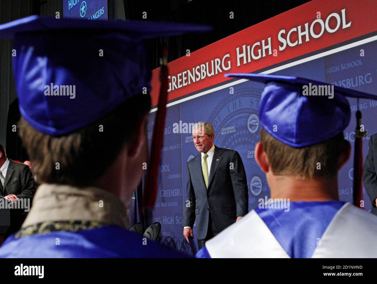 U.S. President W. Bush hands out diplomas as he takes part in a