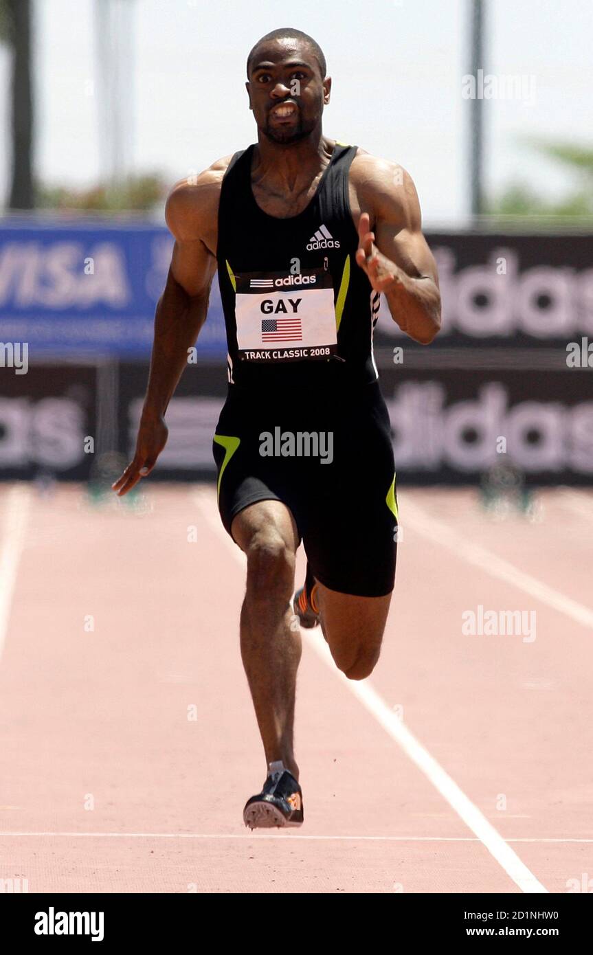 Tyson Gay of the U.S. runs on his way to winning the men's 100 meter dash  during the Adidas Track Classic in Carson, California May 18, 2008.  REUTERS/Danny Moloshok (UNITED STATES Stock