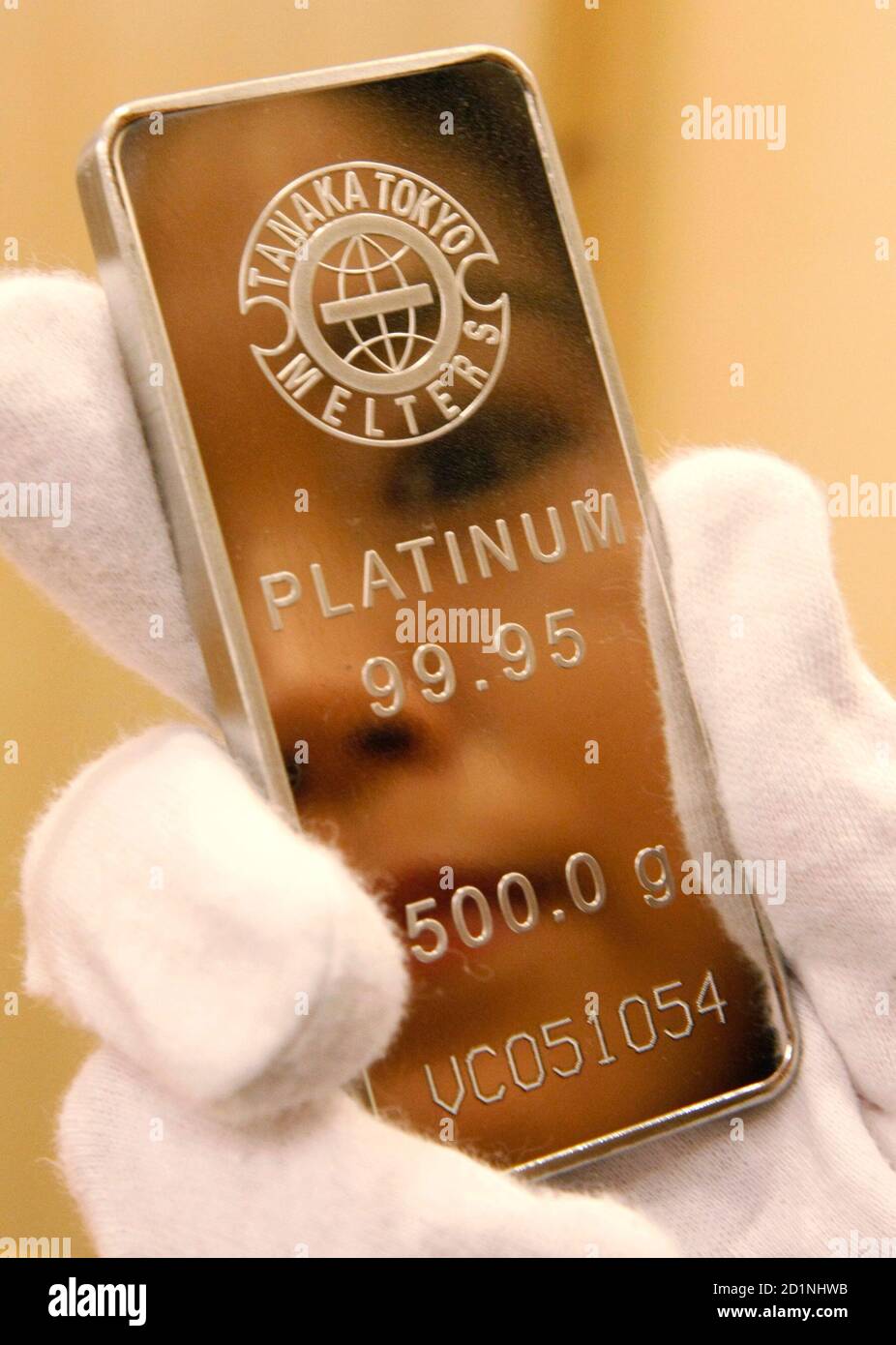 An employee of Tanaka Kikinzoku Jewelry K.K. holds a platinum bar at the  company's store in Tokyo in this January 29, 2008 file photo. Platinum  surged 50 percent this year to hit