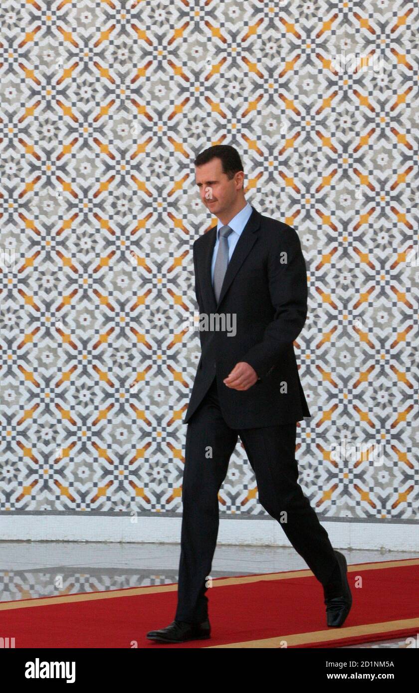 Syria S President Bashar Al Assad Walks Out Of His Office To Welcome His Counterpart From Guyana Bharrat Jagdeo At Al Shaeb Presidential Palace In Damascus March 22 09 Reuters Khaled Al Hariri Syria Politics Stock Photo