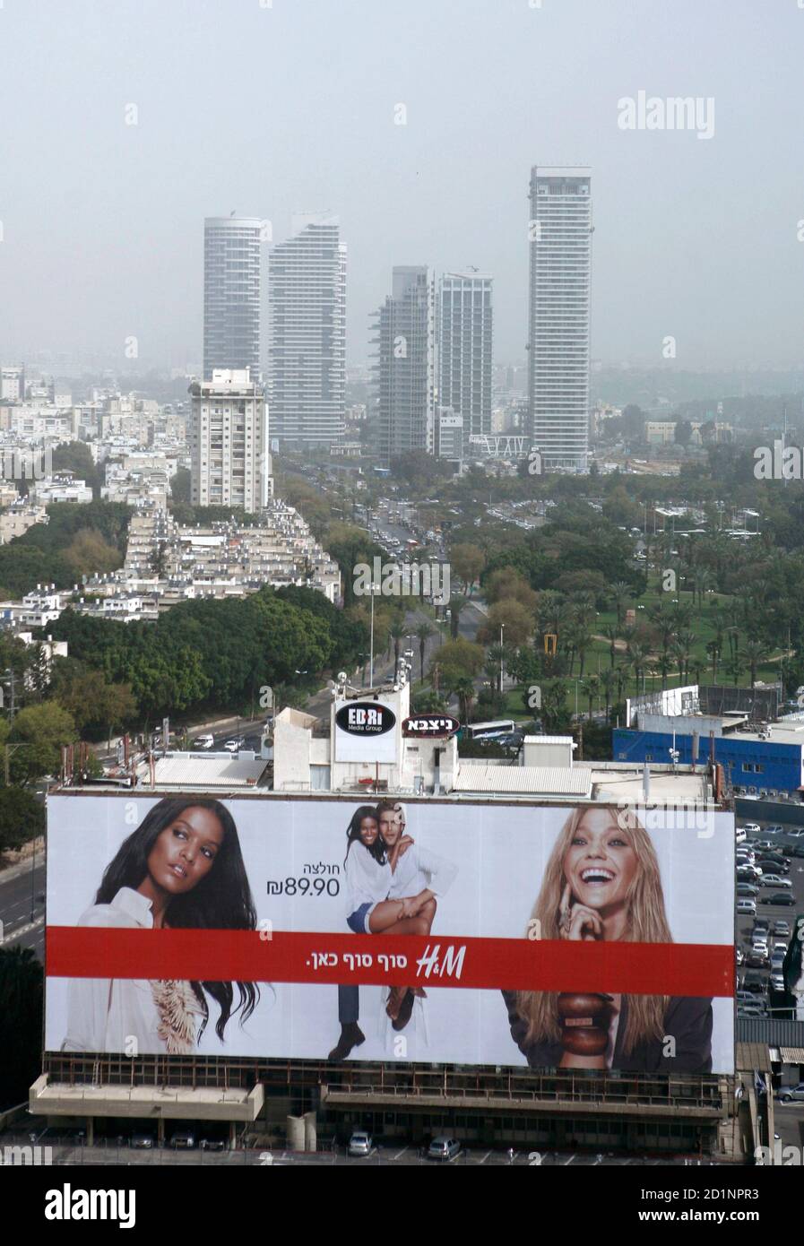 An advertisement for Hennes & Mauritz (H&M) is seen in Tel Aviv March 10,  2010. Karl-Johan Persson, Chief Executive Officer of Swedish retailer H&M,  is in Israel for the launch of the