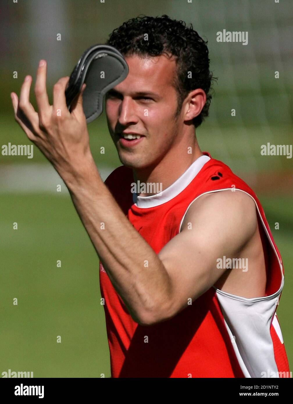 Switzerland's national soccer team player Marco Streller holds up his shinpads during a World Cup training session in Bad Bertrich June 11, 2006. REUTERS/Pascal Lauener (GERMANY) Stock Photo