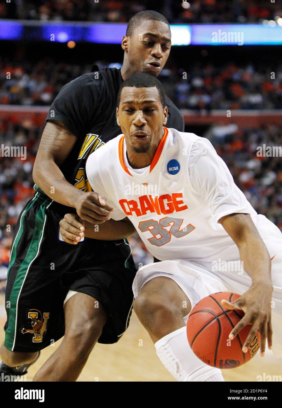 Syracuse's Kris Joseph is guarded by his brother, Vermont's Maurice Joseph (L) during the first half of their NCAA Division I Men's Basketball Tournament game in Buffalo, New York, March 19, 2010.     REUTERS/Mark Blinch (UNITED STATES - Tags: SPORT BASKETBALL) Stock Photo