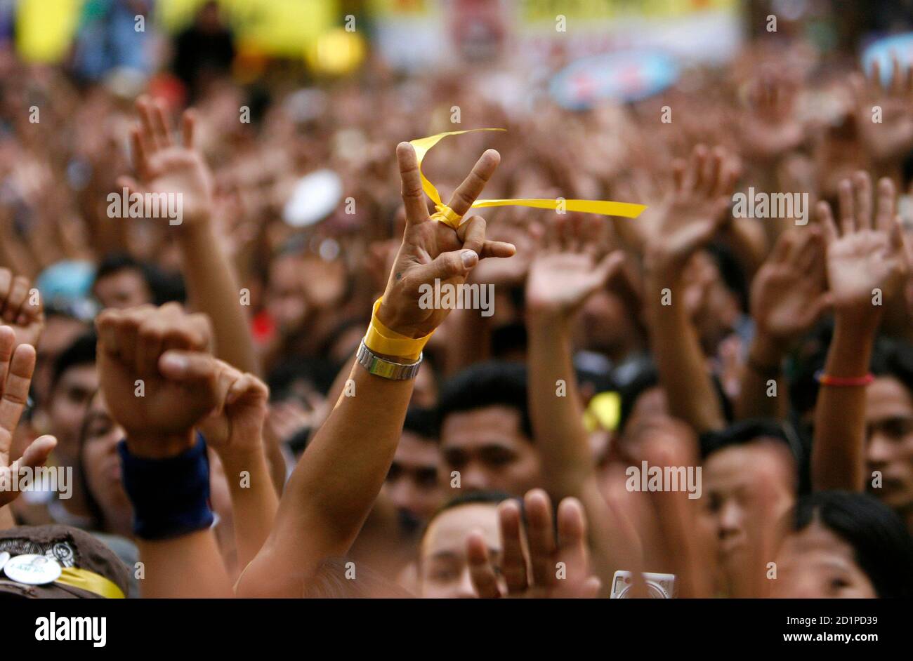 A Protester With A Yellow Ribbon Tied To His Hand The Colour Of The First People Power Revolt In 1986 Gestures During A Rally In The Capital S Financial District Of Makati City