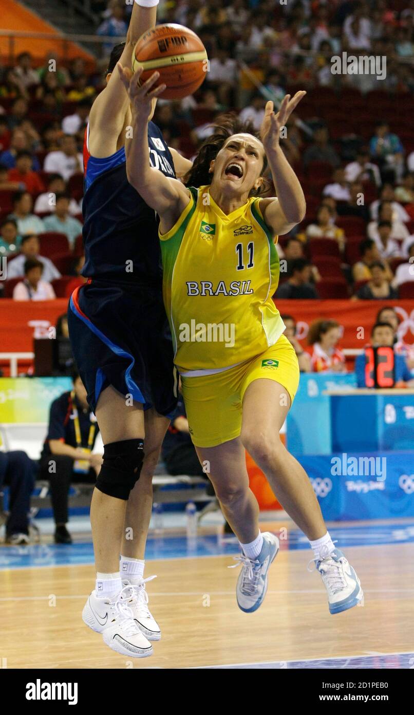 Soeli Akrzeski of Brazil goes for a lay-up as Kim Kwe-ryong (L) of South Korea tries to block during their Group A women's basketball game at the Beijing 2008 Olympic Games August 9, 2008.     REUTERS/Sergio Perez (CHINA) Stock Photo