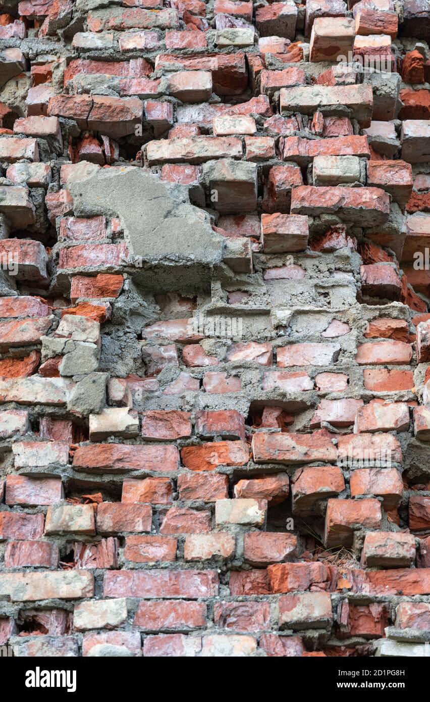 Bright red bricks wall flat background. Vertical photo Stock Photo