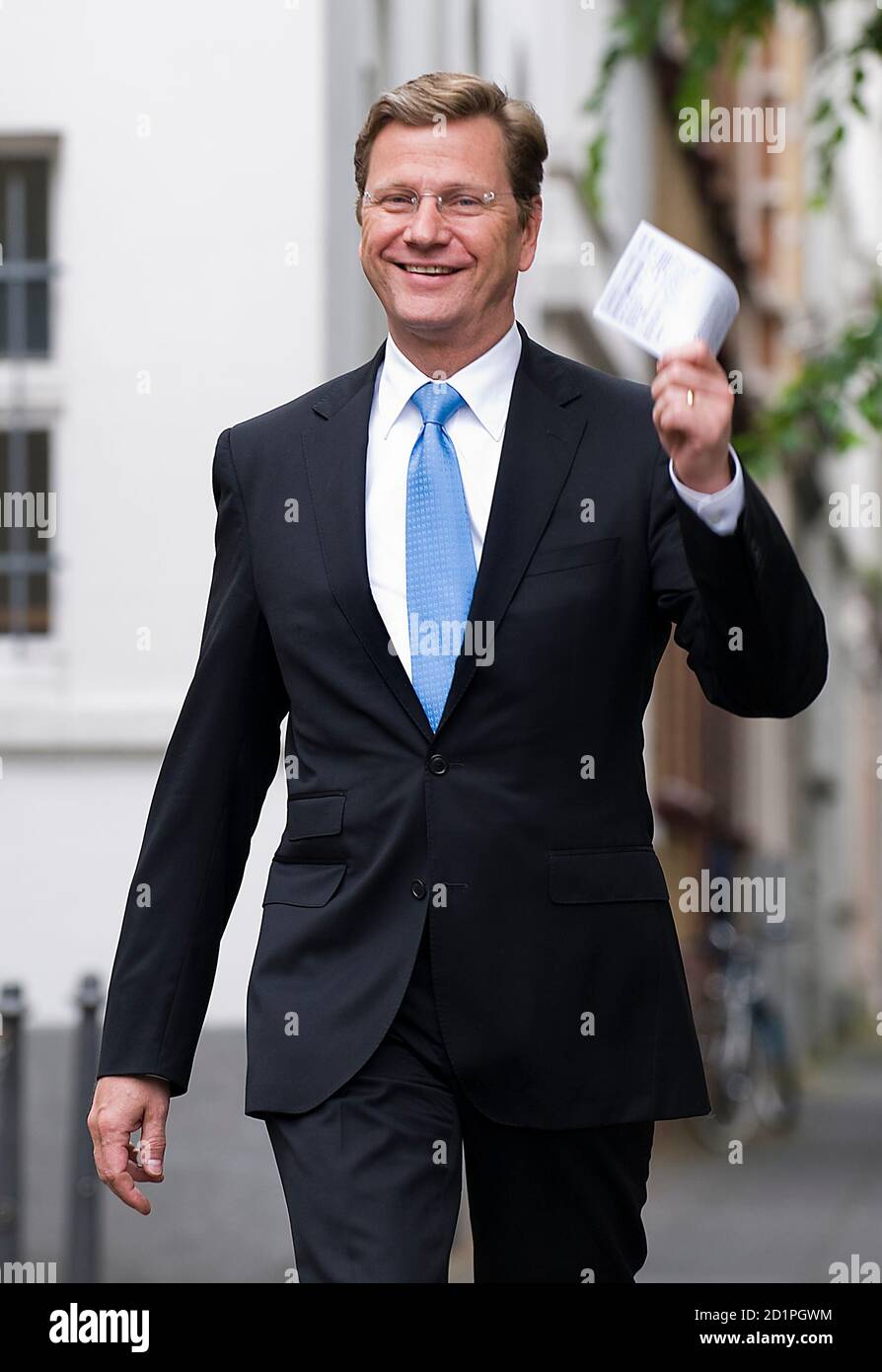 Free Democratic Party (FDP) party leader Guido Westerwelle arrives to cast his vote during the European Parliament elections at a parish office in Bonn June 7, 2009. REUTERS/KNA-BILD/Kirsten Neumann (GERMANY POLITICS ELECTIONS) Stock Photo