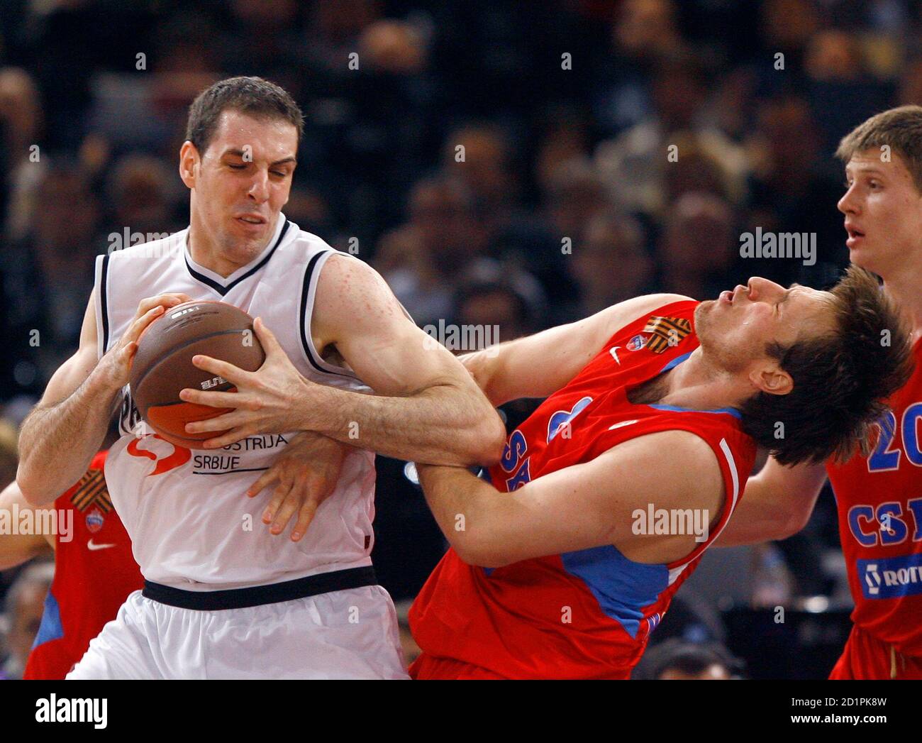 Partizan Belgrade's Aleks Maric (L) is guarded by CSKA Moscow's Matjaz  Smodis during their Euroleague Basketball