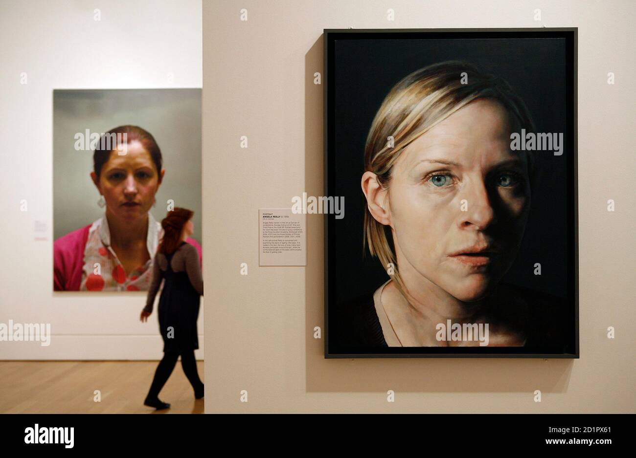 A portrait by Angela Reilly (R) is displayed at the National Portrait Gallery in central London June 11, 2008. All four portraits shortlisted for this year's BP Portrait Award are by male artists featuring female subjects, and several works selected for a special exhibition deal with ageing and faith. The annual competition attracted over 1,700 entries in 2008 of which about one third came from outside the United Kingdom. REUTERS/Alessia Pierdomenico (BRITAIN) Stock Photo