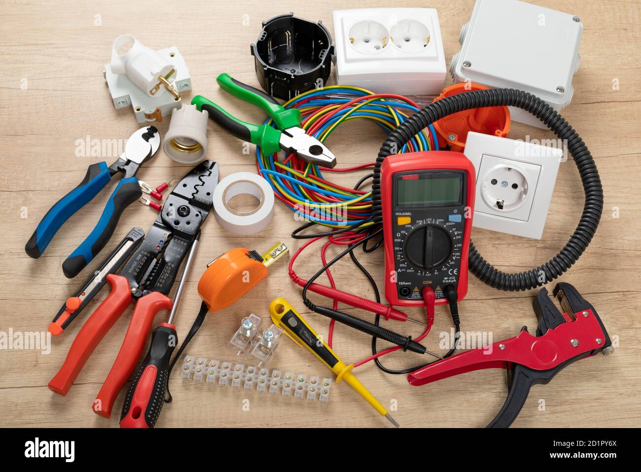 Tools for electrician needs: shocket multimeter, voltage testers, wire strippers, pliers, Stock Photo