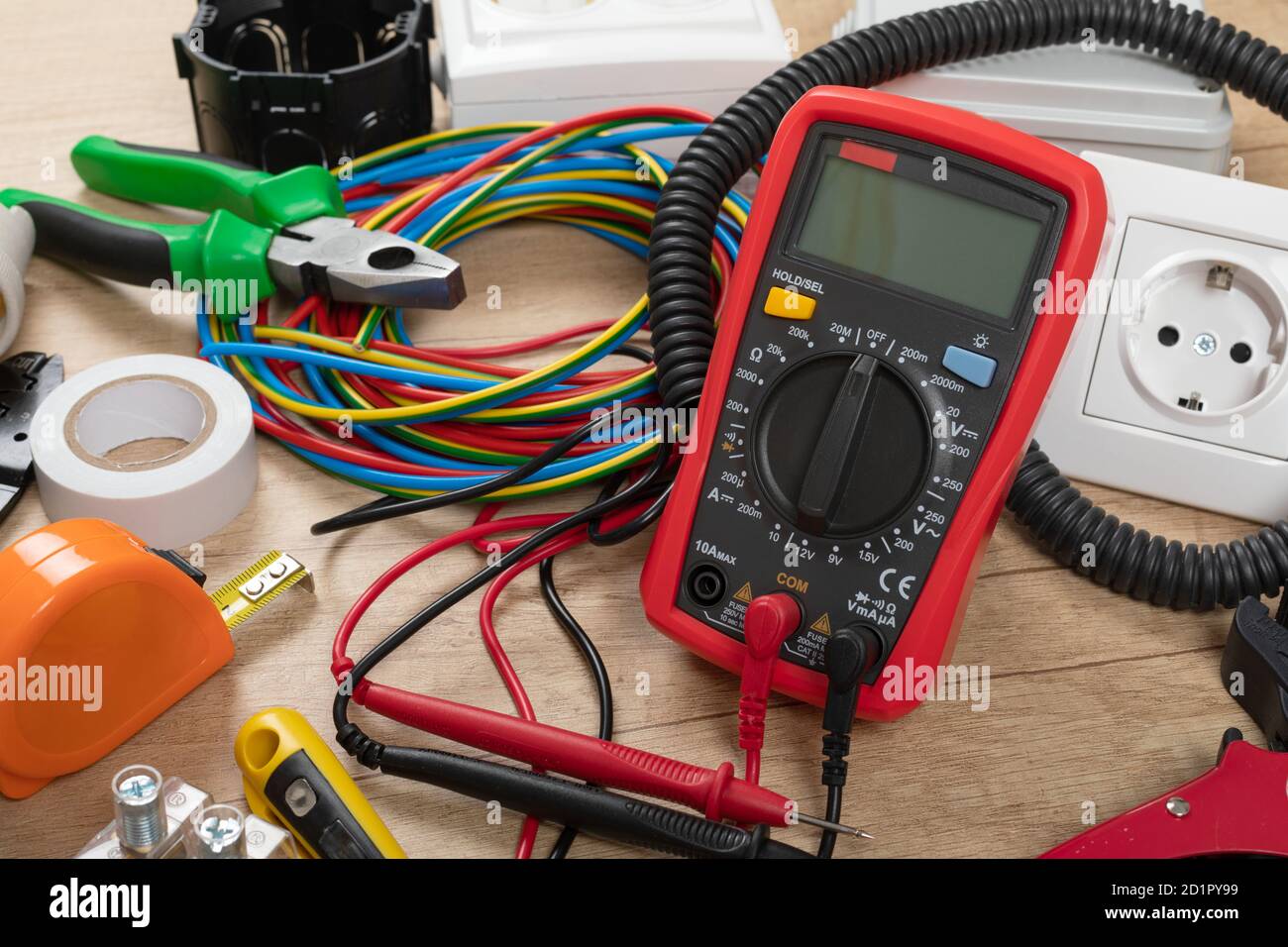 Tools for electrician needs: shocket multimeter, voltage testers, wire strippers, pliers, Stock Photo
