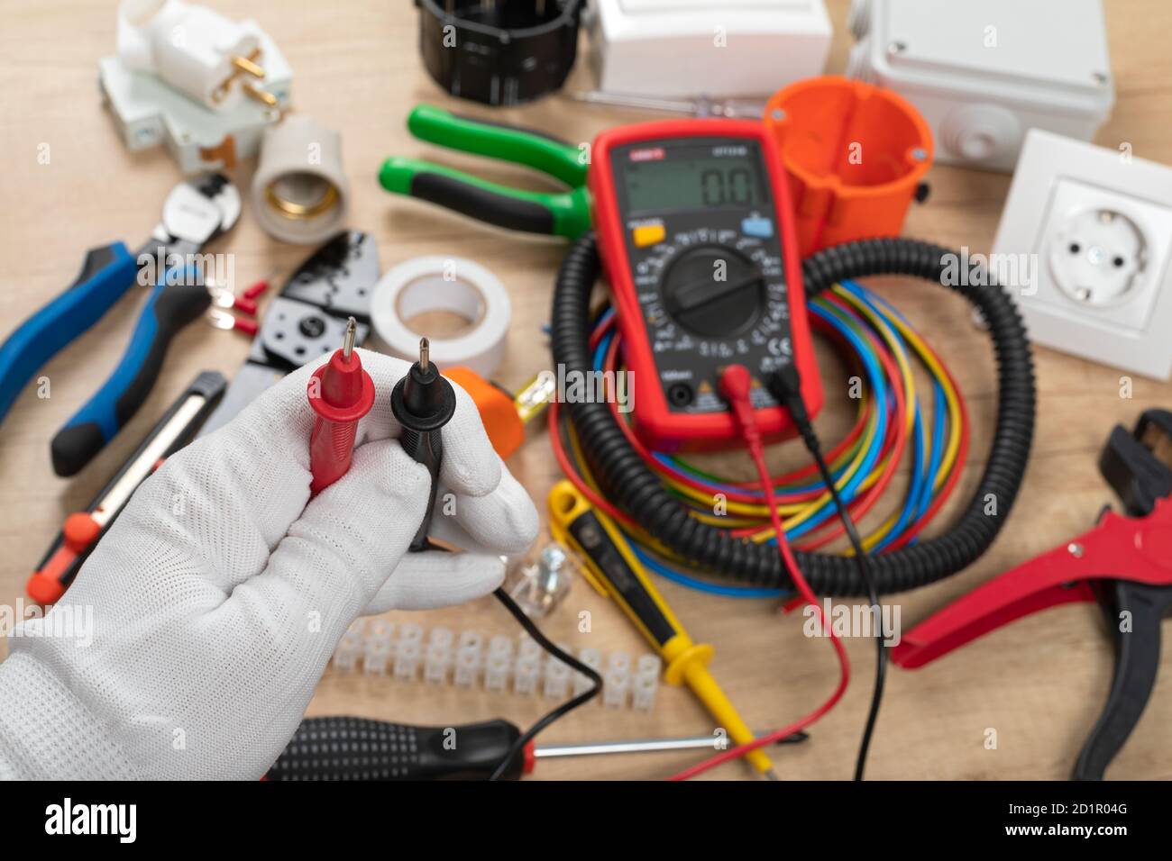 Tools for electrician needs: shocket multimeter, voltage testers, wire strippers, pliers, Stock Photo