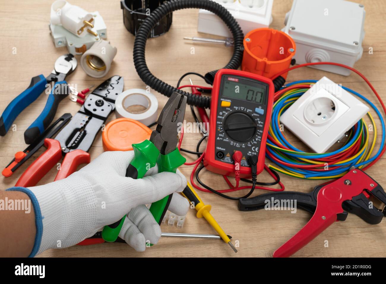 Tools for electrician needs: shocket multimeter, voltage testers, wire strippers, pliers, Stock Photo