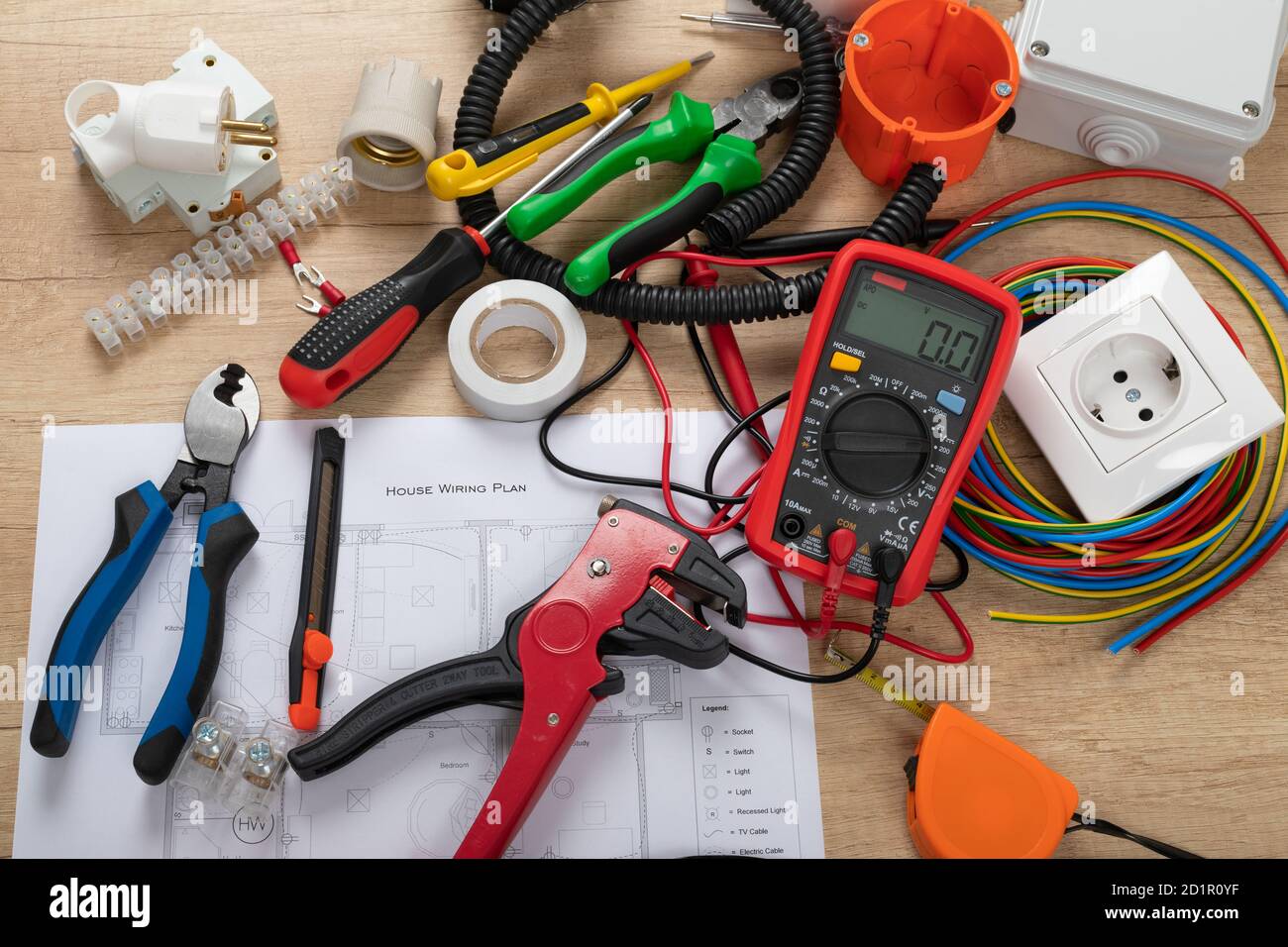 Tools for electrician needs: shocket multimeter, voltage testers, wire strippers, pliers, Stock Photo