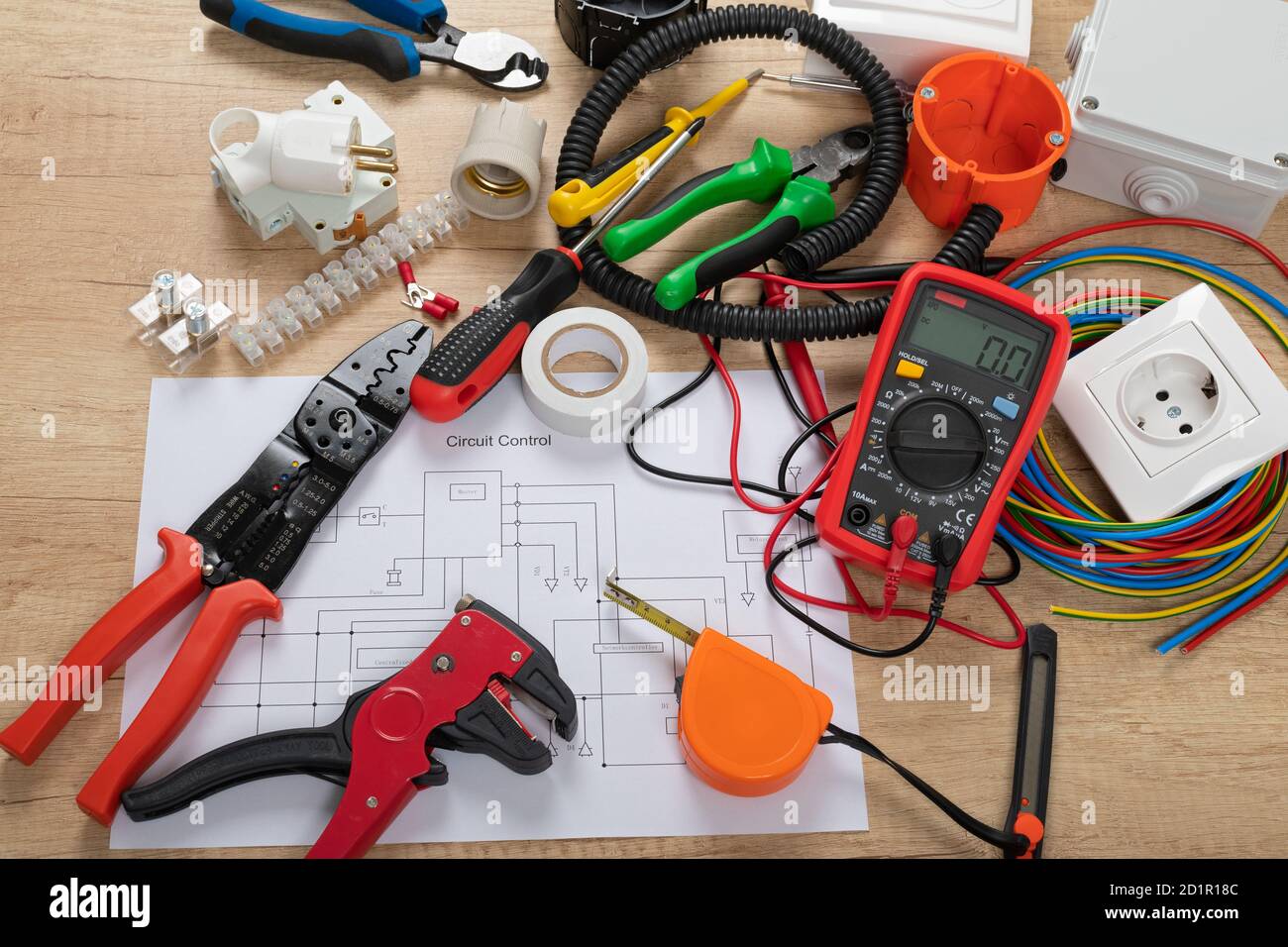 Tools for electrician needs: shocket multimeter, voltage testers, wire strippers, pliers, Stock Photo