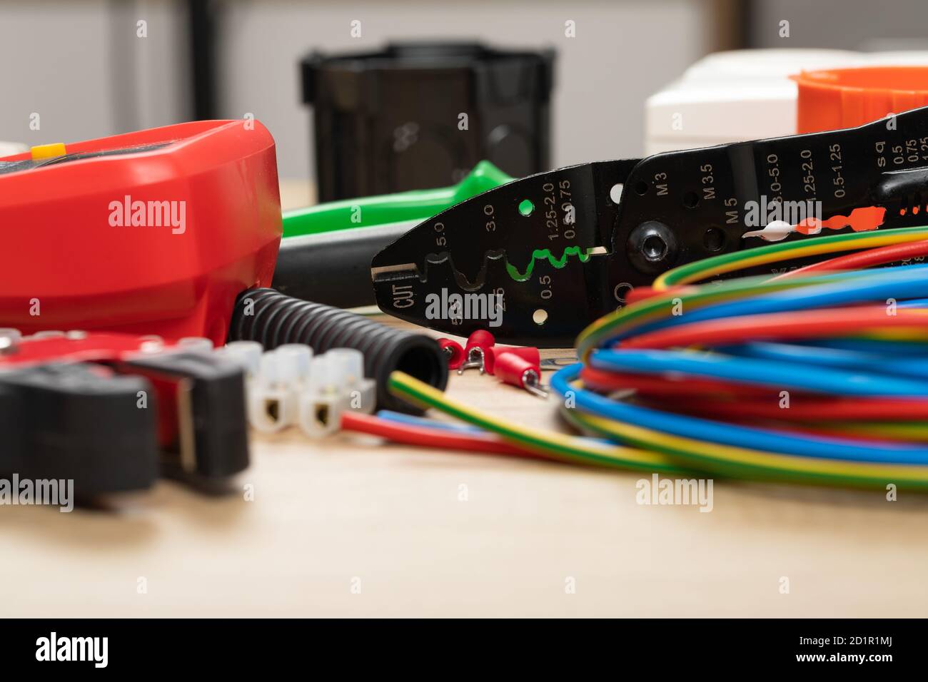 Tools for electrician needs: multimeter, voltage testers, wire strippers, pliers, Stock Photo