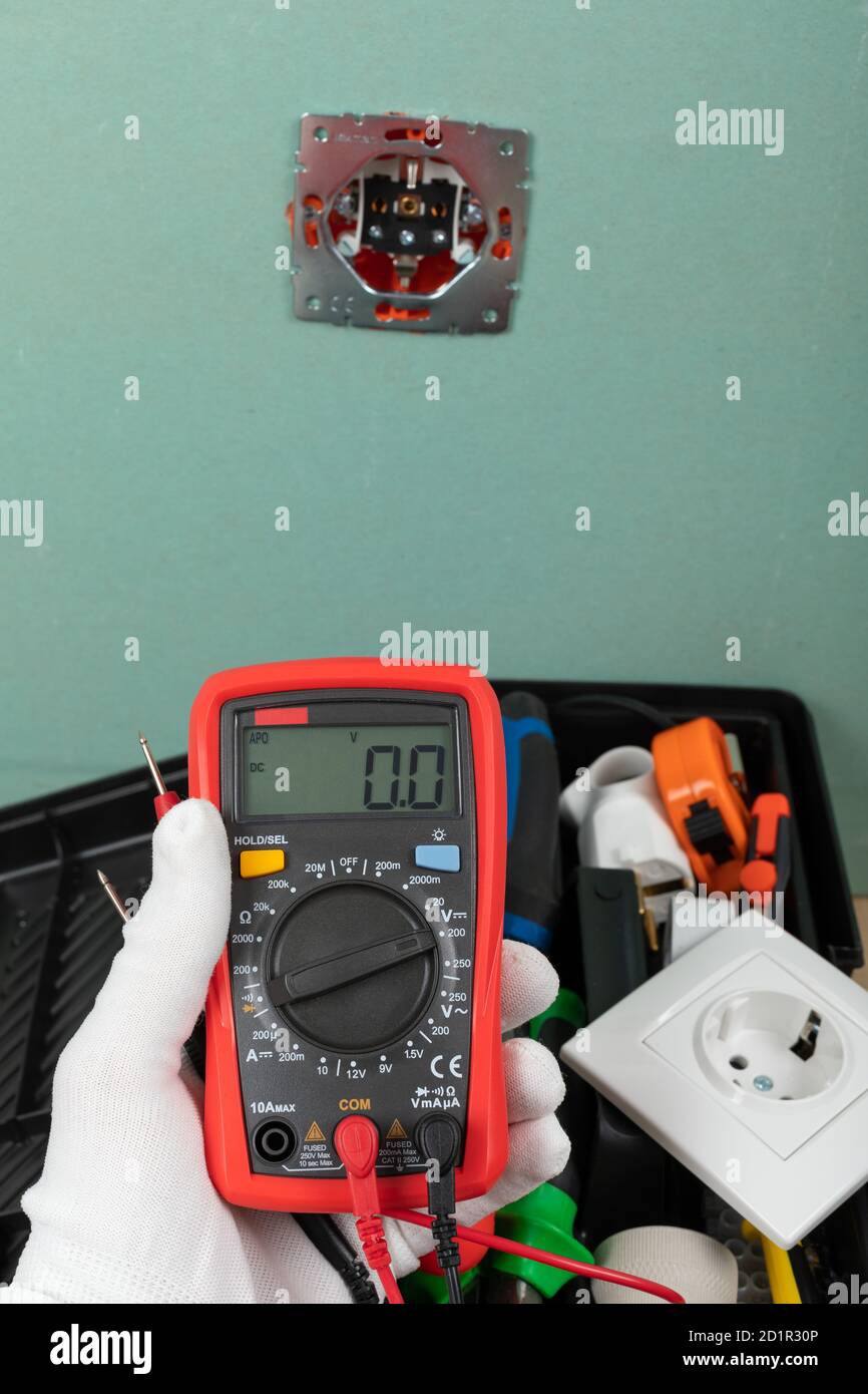 Tools for electrician needs: shocket multimeter, voltage testers, wire strippers, pliers, Stock Photo