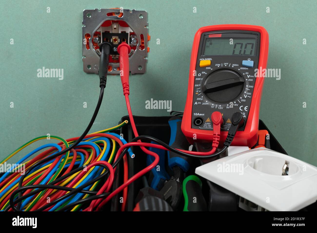 Tools for electrician needs: shocket multimeter, voltage testers, wire strippers, pliers, Stock Photo