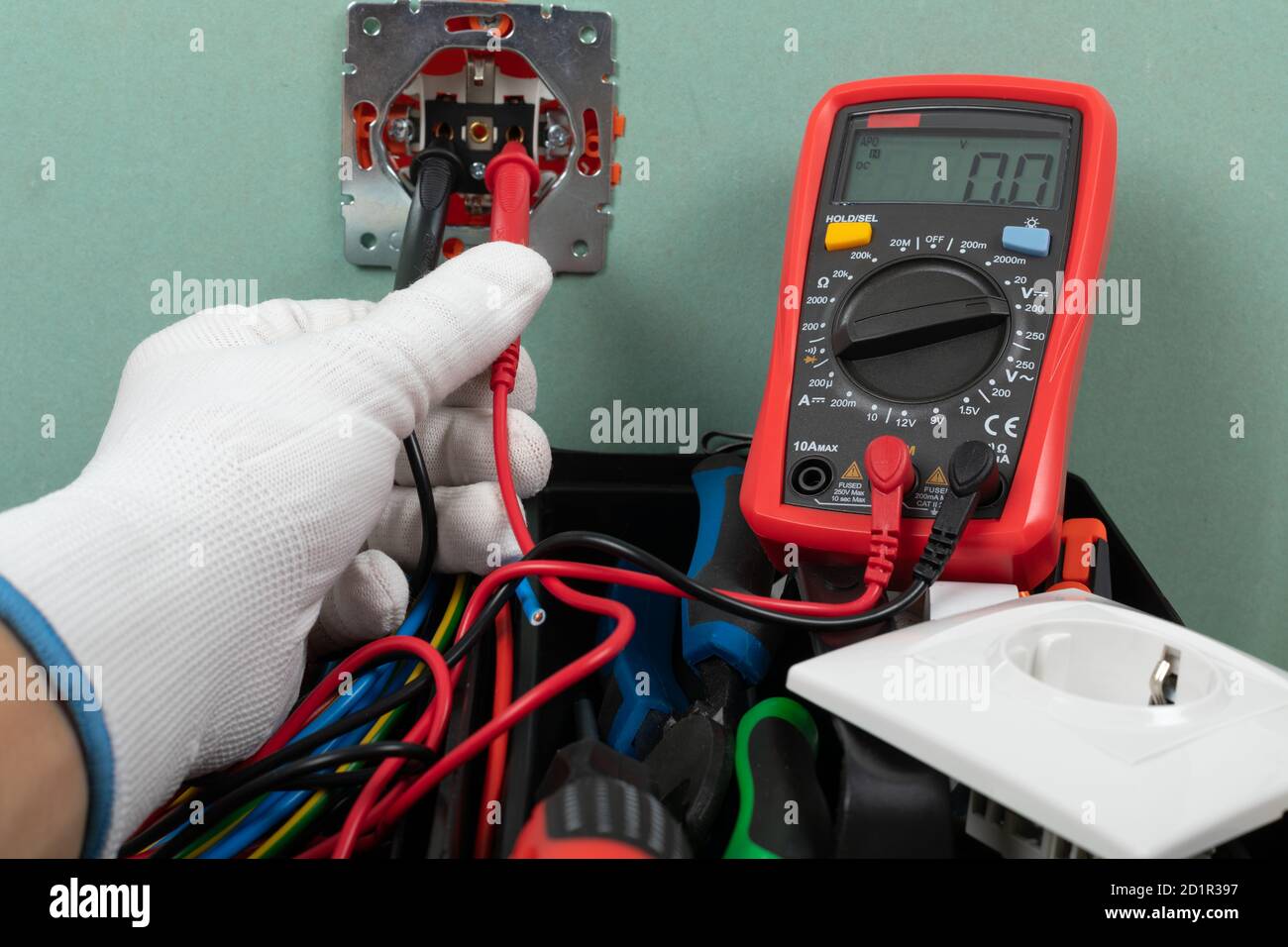 Tools for electrician needs: shocket multimeter, voltage testers, wire strippers, pliers, Stock Photo