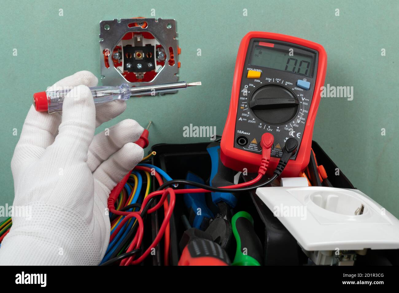 Tools for electrician needs: shocket multimeter, voltage testers, wire strippers, pliers, Stock Photo