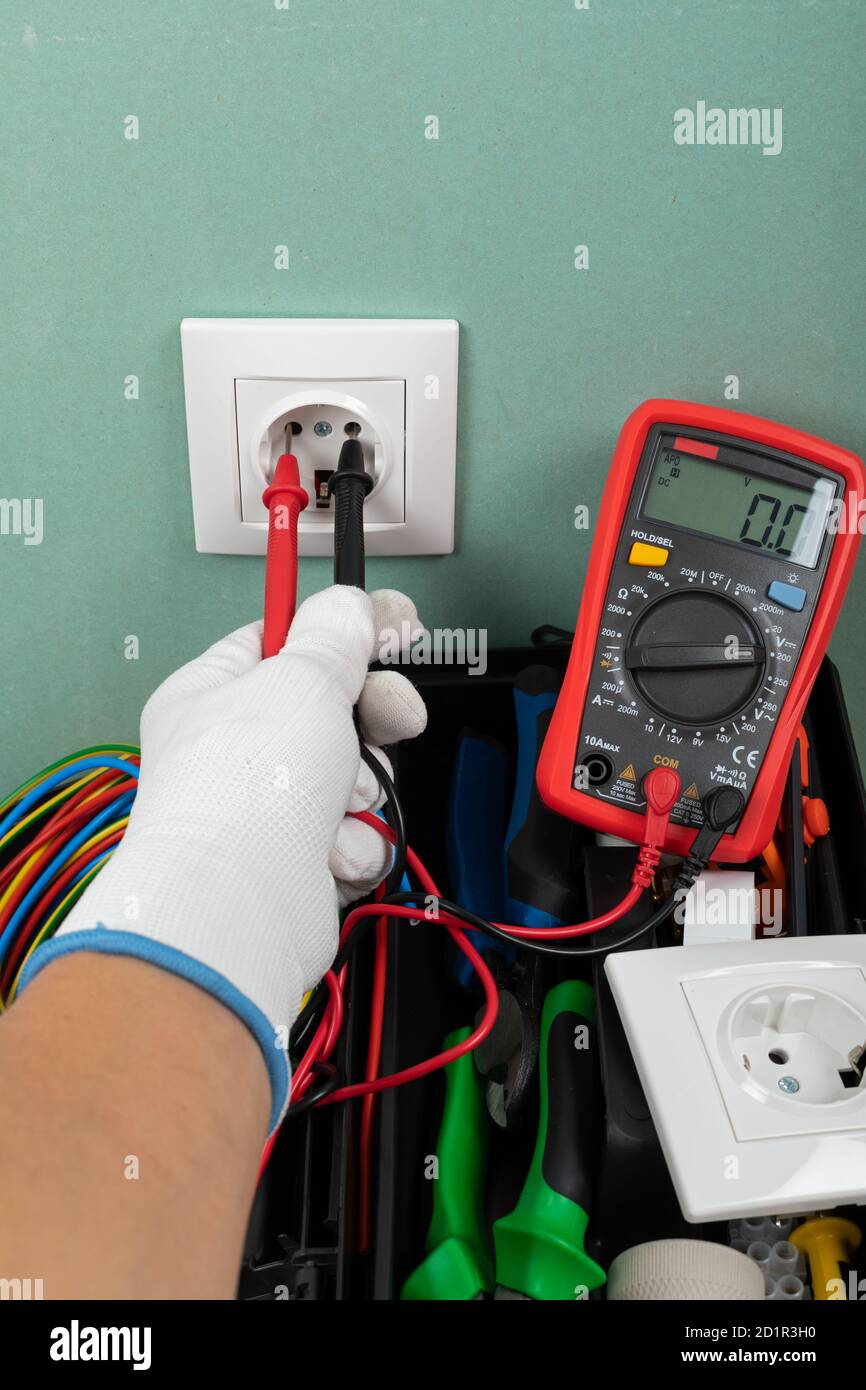 Tools for electrician needs: shocket multimeter, voltage testers, wire strippers, pliers, Stock Photo