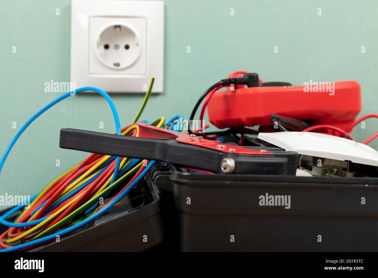 Tools for electrician needs: multimeter, voltage testers, wire strippers, pliers, Stock Photo