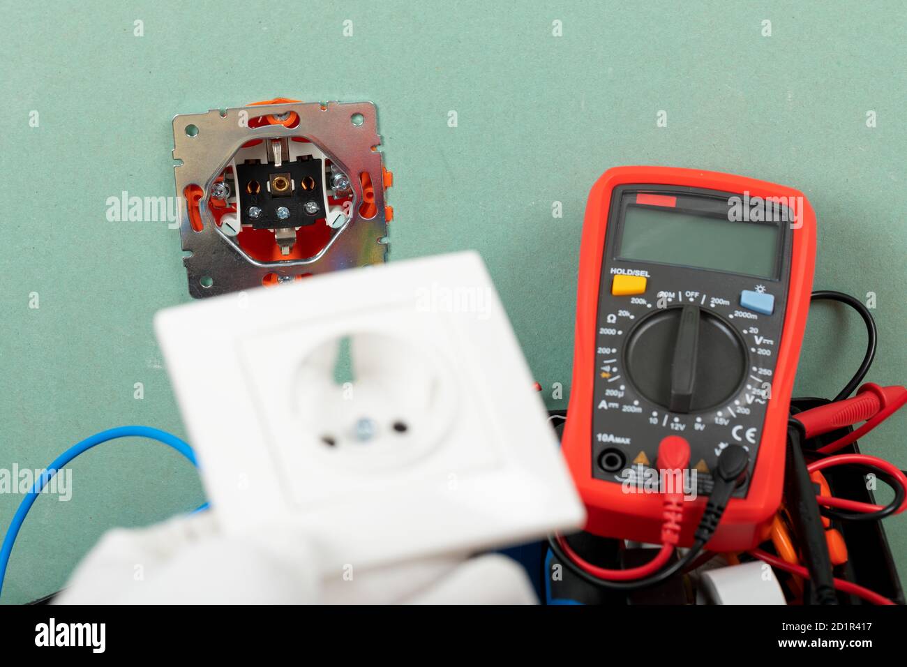 Tools for electrician needs: multimeter, voltage testers, wire strippers, pliers, Stock Photo