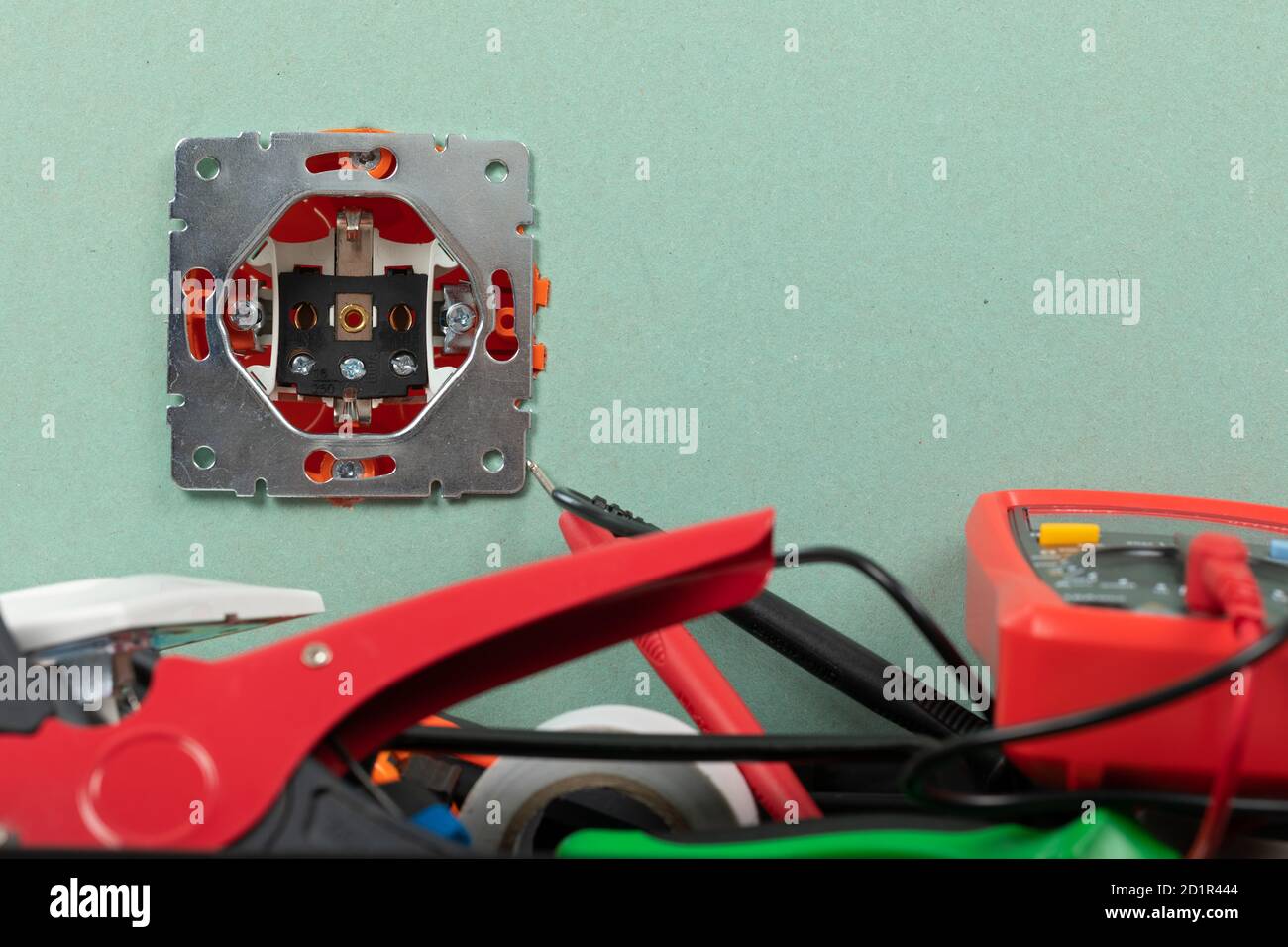 Tools for electrician needs: multimeter, voltage testers, wire strippers, pliers, Stock Photo