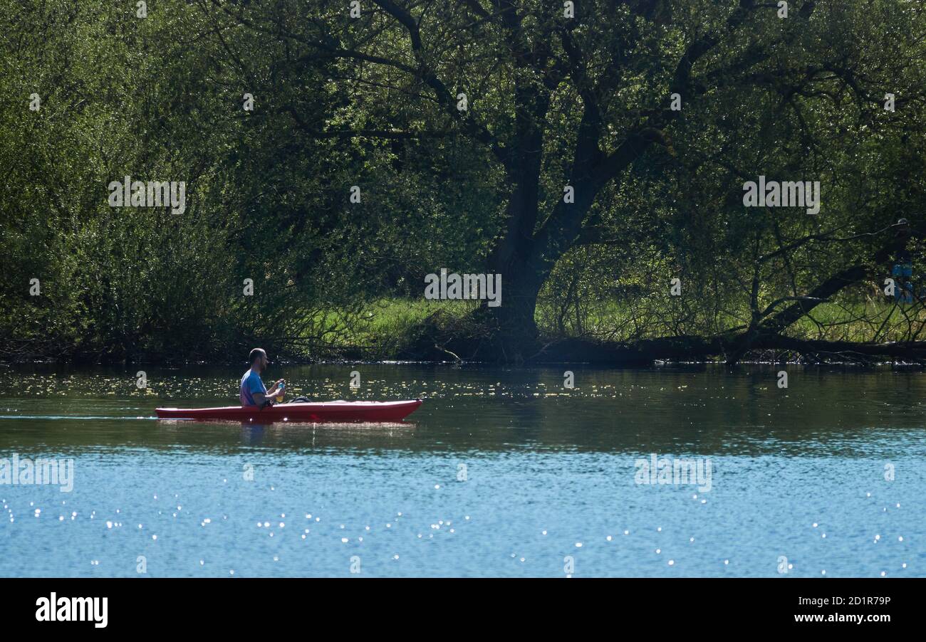 Braunschweig, Germany, April 18., 2020: Kayaker in spring on the South Lake in Braunschweig Stock Photo
