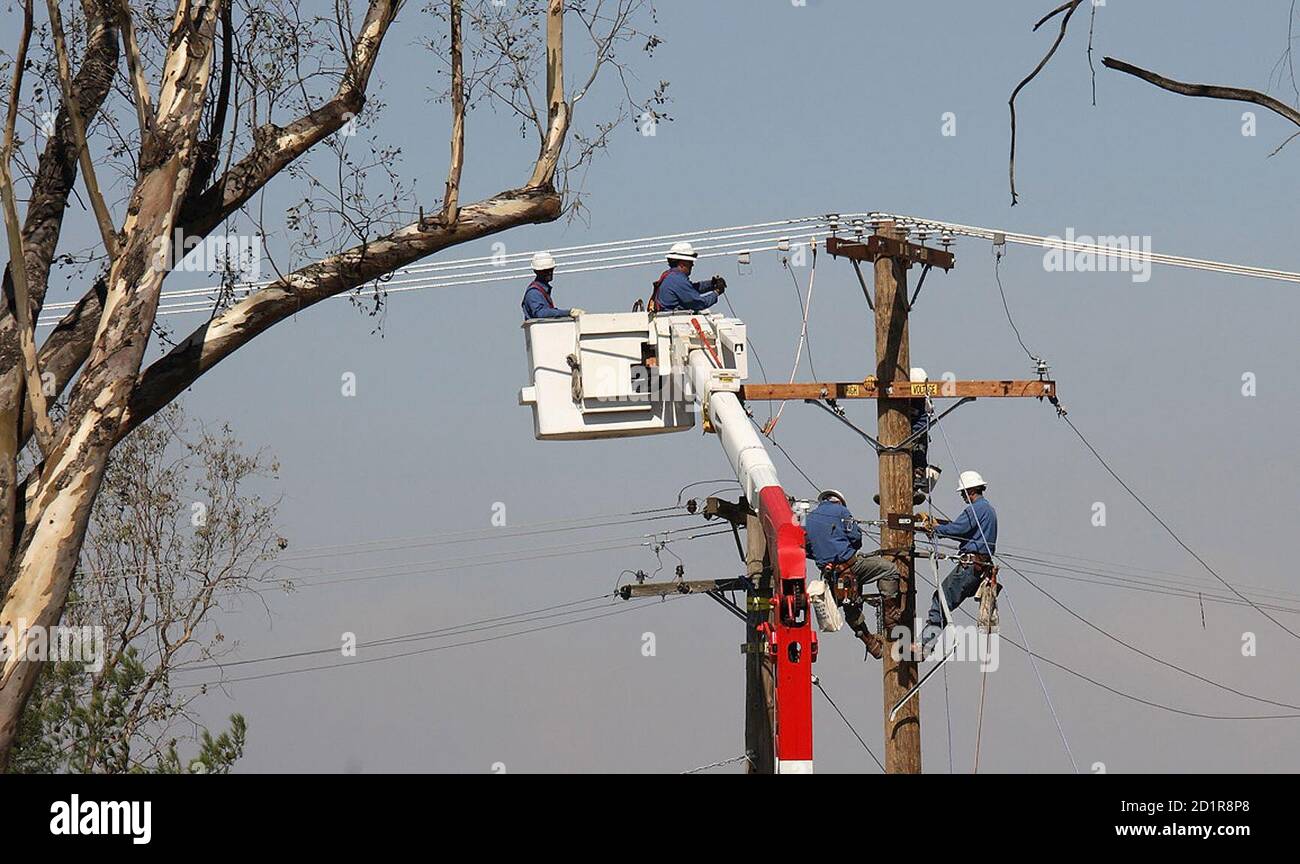 Workers repair power lines damaged hi-res stock photography and images -  Alamy
