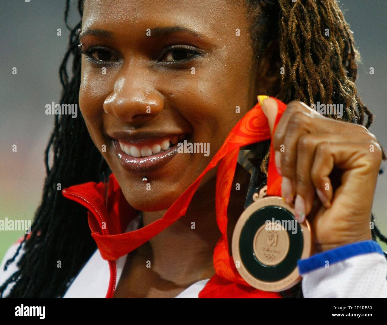 Bronze medallist Tasha Danvers of Britain poses during the medal ceremony for the women's 400m hurdles event of the athletics competition at the Beijing 2008 Olympic Games August 21, 2008.     REUTERS/Mike Blake (CHINA) Stock Photo