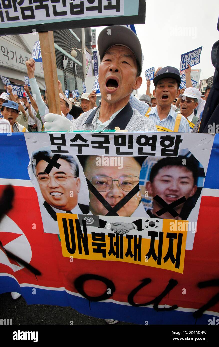 Conservative Protesters Shout Slogans As They Hold North Korean Flags And Portraits Of North Korean Leader Kim Jong Il Family During An Anti North Korea Rally Denouncing The North S Missile Launch And Former South