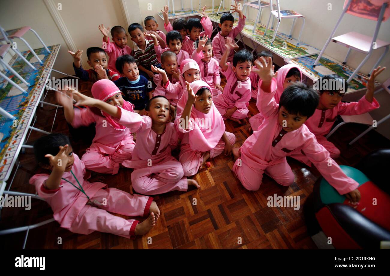 Malaysian Muslim Boys And Girls Sit Together In A Classroom During A Lesson At The Islam Hadhari Preschool In Putrajaya Outside Kuala Lumpur February 27 2007 Malaysia S Moderate Muslim Premier Abdullah Ahmad