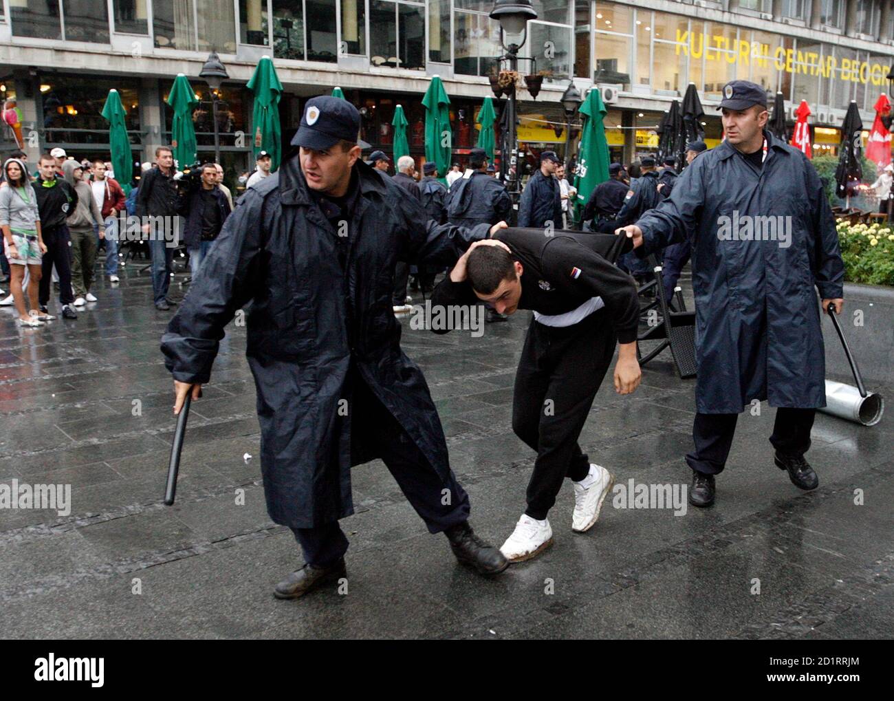 Serbian riot police arrest a pro-Karadzic demonstrator in Belgrade July 22,  2008. War crimes fugitive Radovan Karadzic was arrested on Monday near  Belgrade posing as a doctor of alternative medicine, sporting long