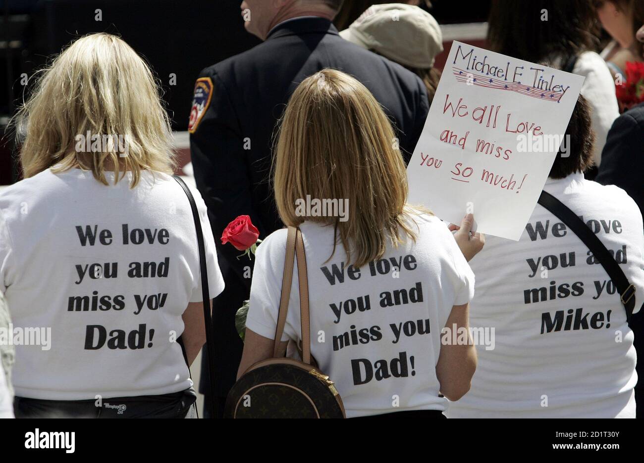 Relatives of Michael E. Tinley wear T-shirts to commemorate him 