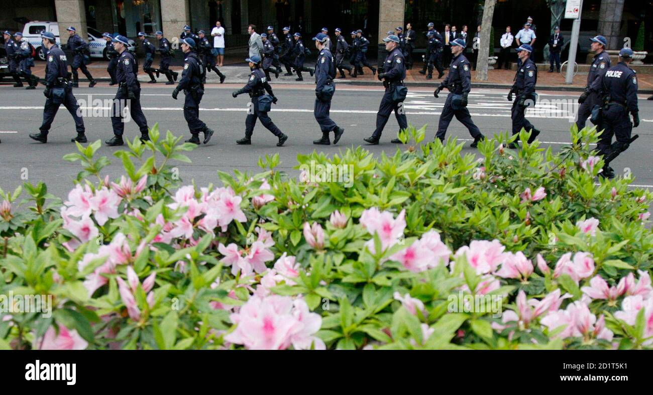 Police reinforcements arrive at Hyde Park where police were keeping protesters away from the main rally against the Asia-Pacific Economic Cooperation (APEC) summit in Sydney September 8, 2007.  It was predicted to be the flash point of the Asia-Pacific leaders' summit, tens of thousands of protesters clashing with police, but in the end Saturday's anti-APEC march was a peaceful kaleidoscope of protests.     REUTERS/Russell Boyce  (AUSTRALIA) Stock Photo