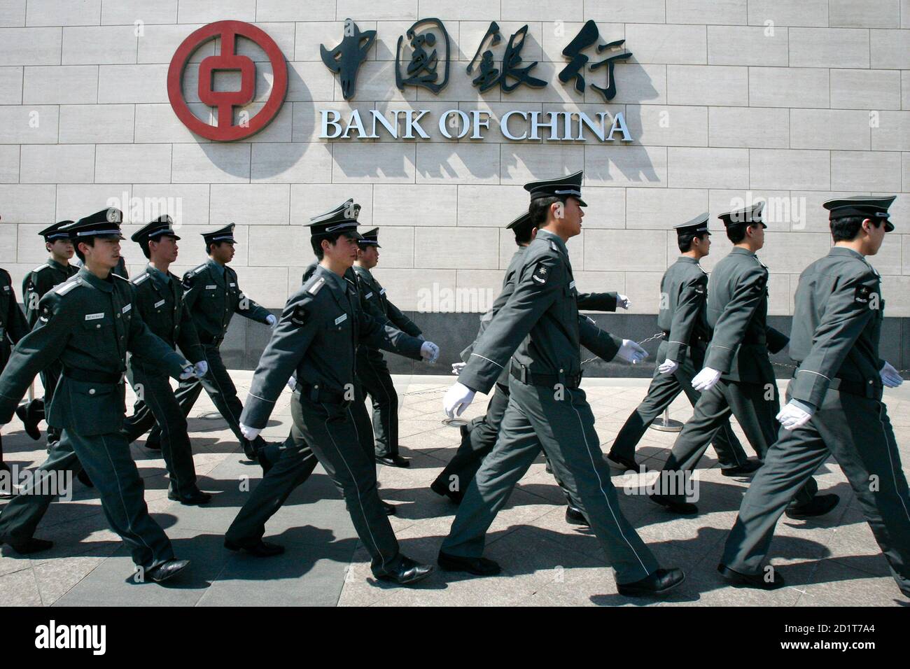 Chinese security guards march outside the Bank of China head office in Beijing March 27, 2008. Chinese banks, widely considered as possible buyers of more U.S. financial assets amid the snowballing credit crisis, are becoming picky and cautious due to increasing concerns about investment risks.    REUTERS/Claro Cortes IV   (CHINA) Stock Photo