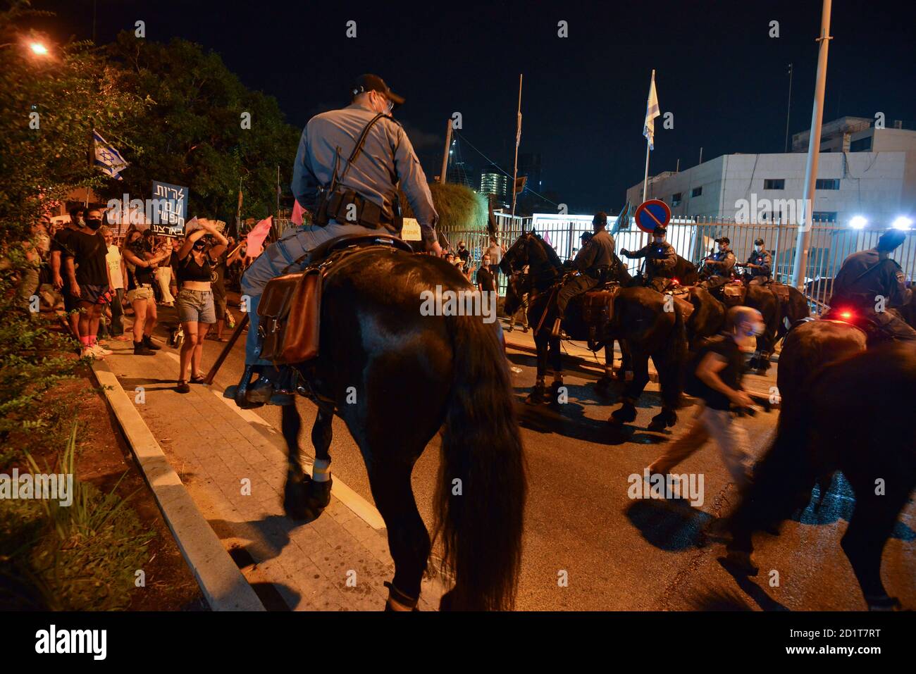 2.10.2020 Tel Aviv, Israel. Protest against Prime minister Netanyahu and second Coronavirus lockdown. Police horses were used to block the protestors from crossing LaGardia street in Tel Aviv, and were guided to use force while pushing the protestors by police horseman Stock Photo