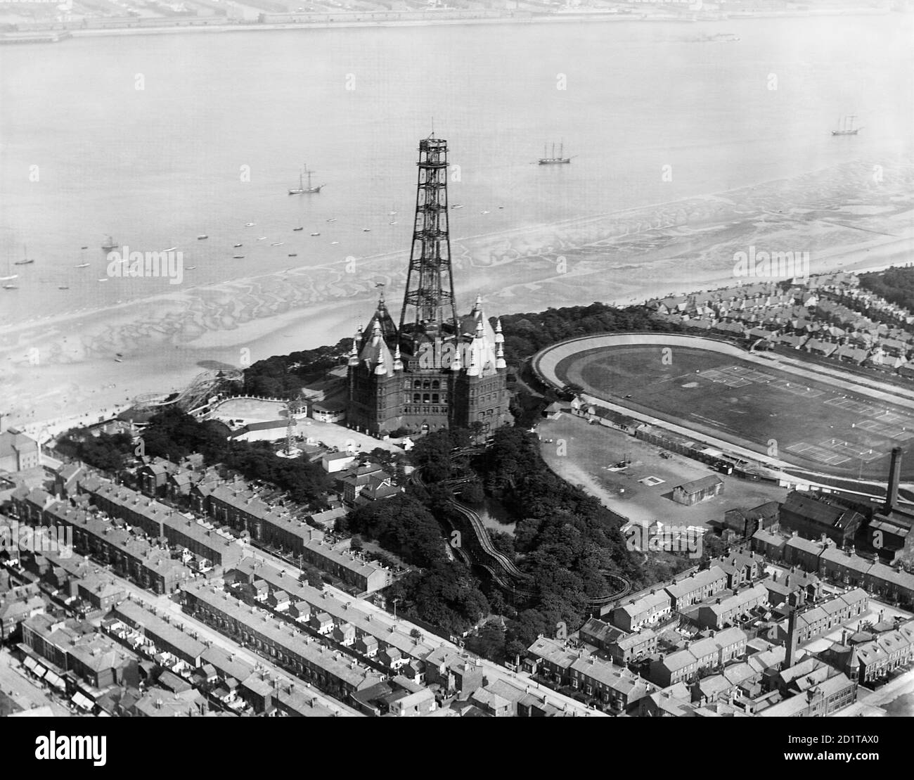 NEW BRIGHTON, Wallasey, Wirral, Merseyside. Aerial view of New Brighton Tower being removed. Constructed in 1896 as an observation tower, it was closed during the First World War. Due to corrosion it was deemed unsafe to reopen and it was dismantled. After its removal in 1921 the ballroom continued to be a popular venue until destroyed by fire in 1969. Photographed in 1920. Aerofilms Collection (see Links). Stock Photo