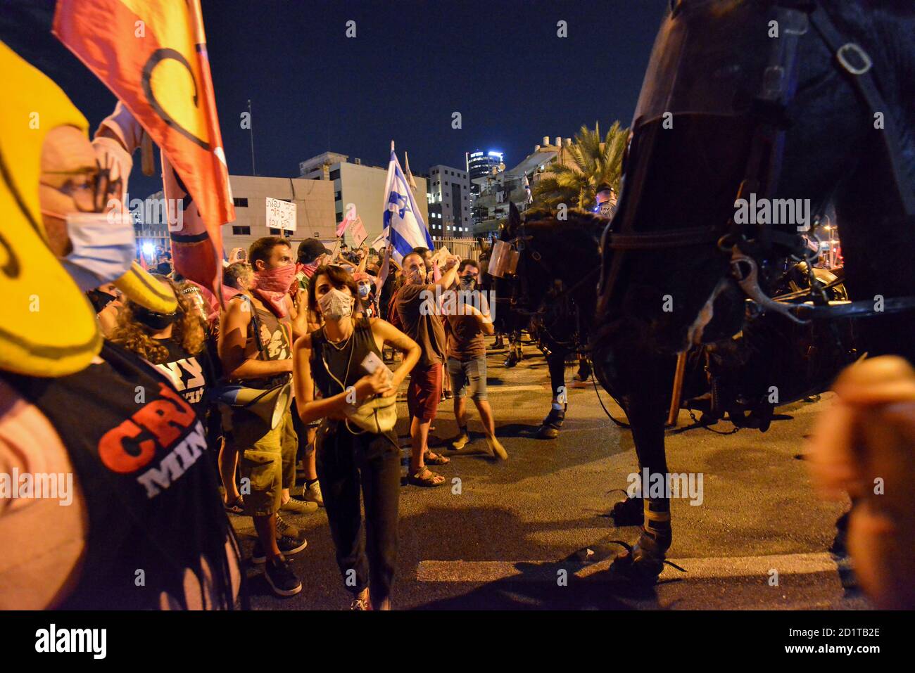 2.10.2020 Tel Aviv, Israel. Protest against Prime minister Netanyahu and second Coronavirus lockdown. Police horses were used to block the protestors from crossing LaGardia street in Tel Aviv, and were guided to use force while pushing the protestors by police horseman Stock Photo