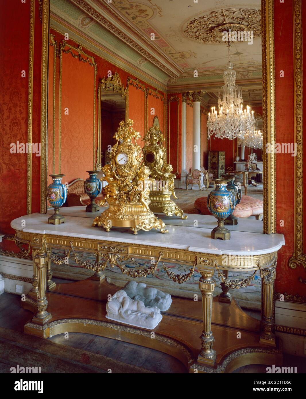 BRODSWORTH HALL, South Yorkshire. Interior view. Table with ornate clock in front of mirror in the Drawing Room. Stock Photo